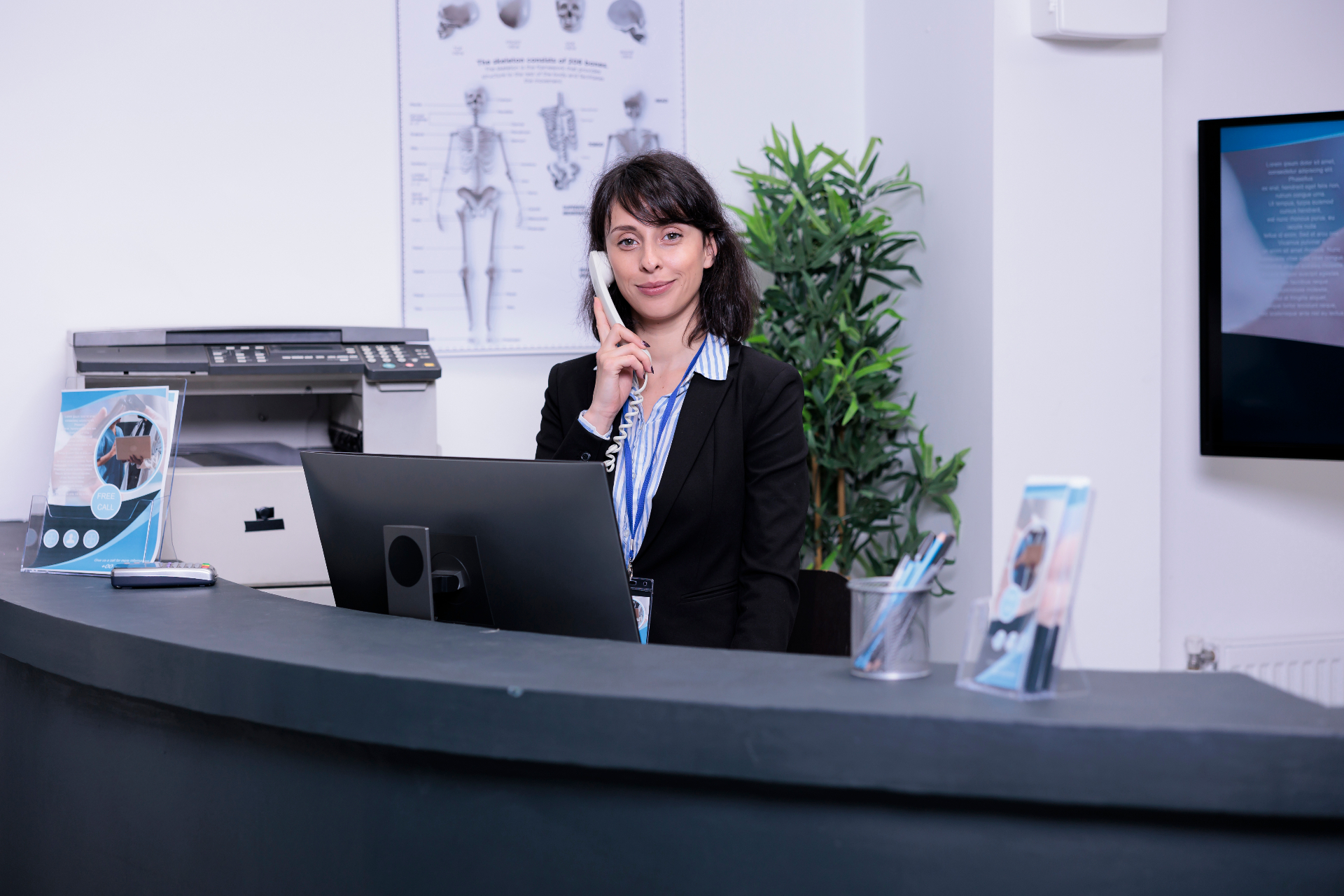 Legal receptionist at a front-desk answering the phone